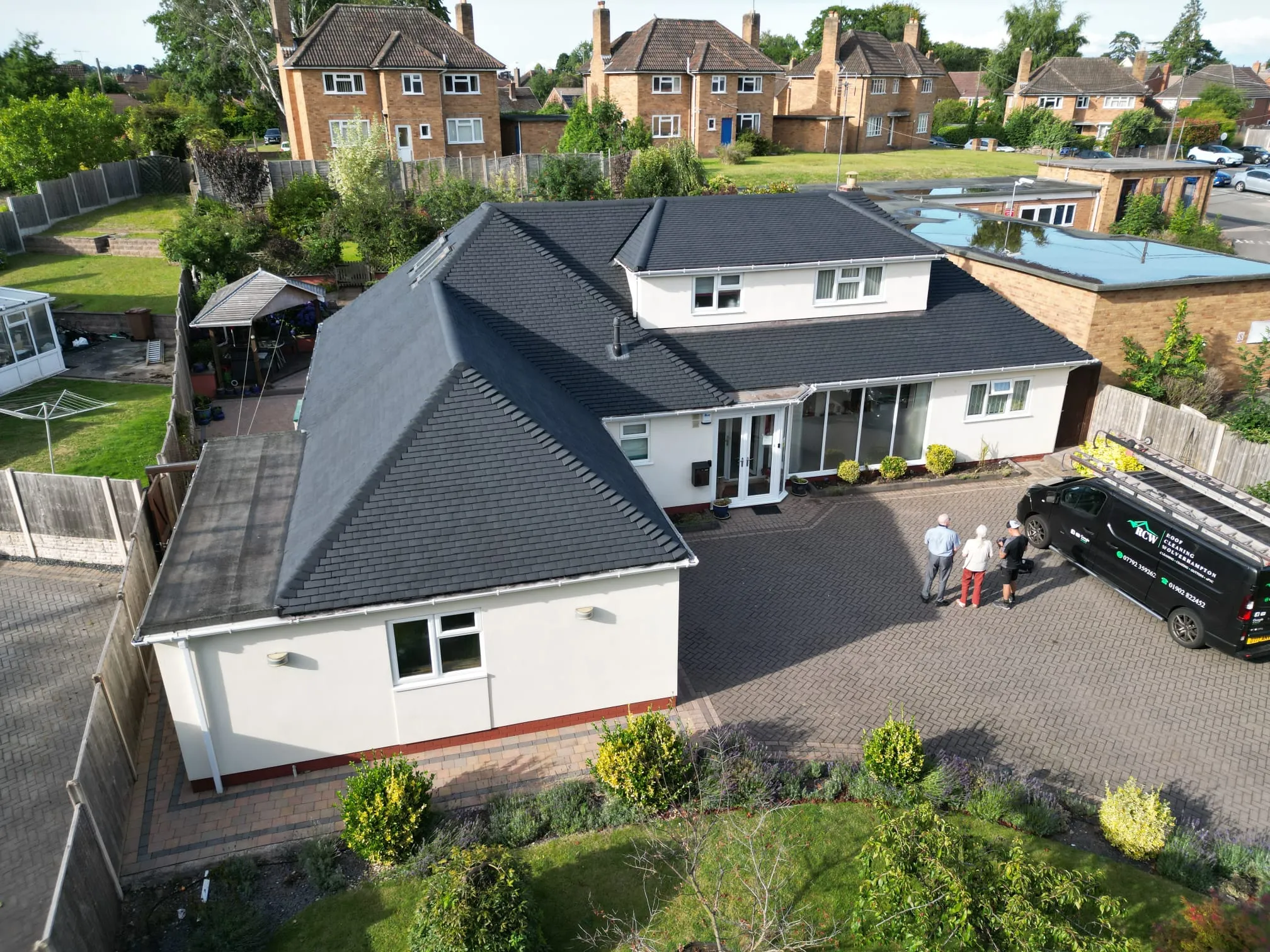 Roof after cleaning and painting in anthracite grey