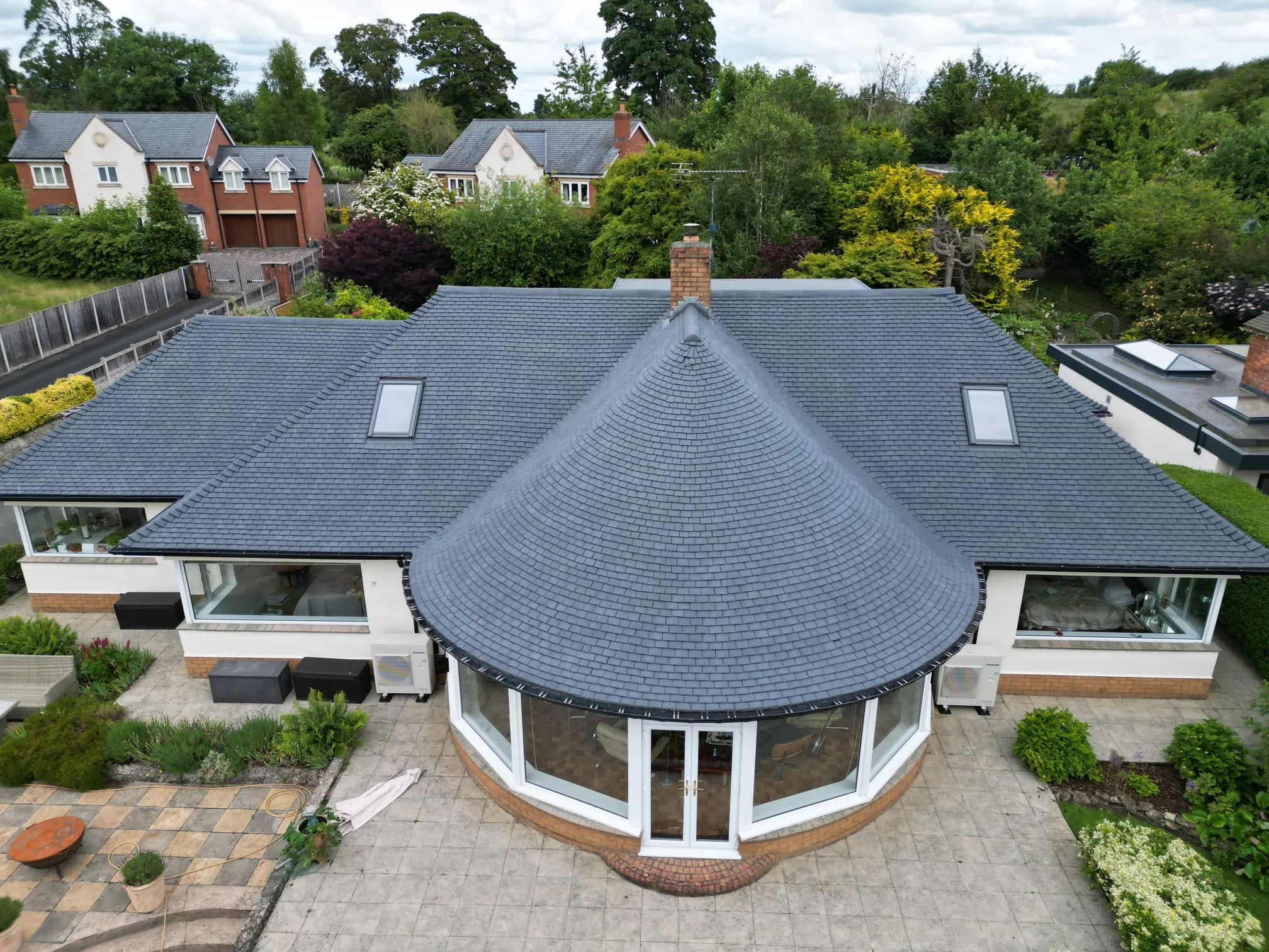 Roof after cleaning and painting in slate grey